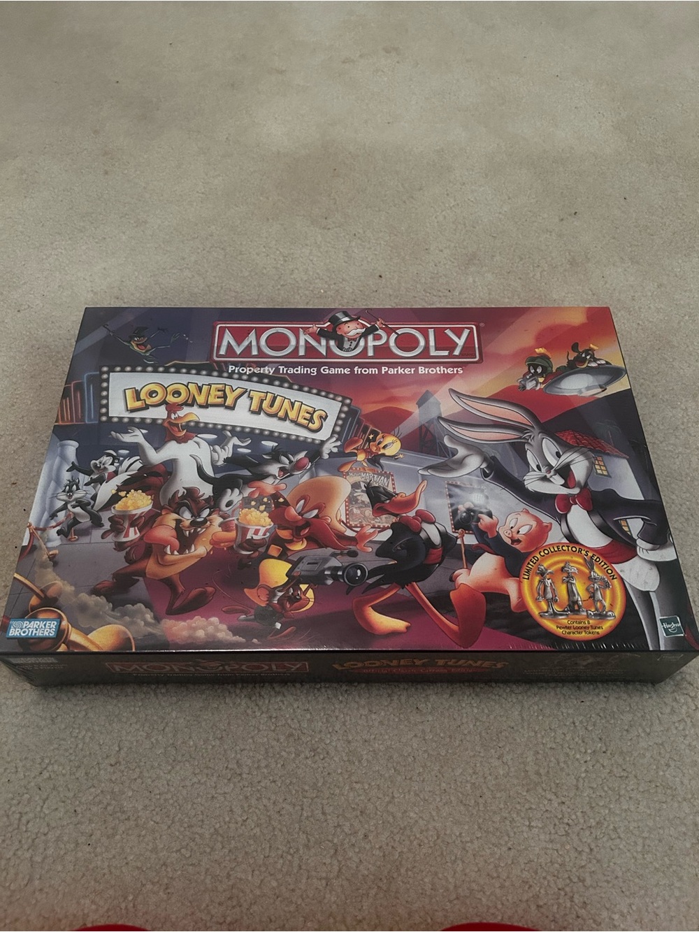 Monopoly Looney Tunes Edition Board Game - Monopoly Brand - Red/Orange Artwork